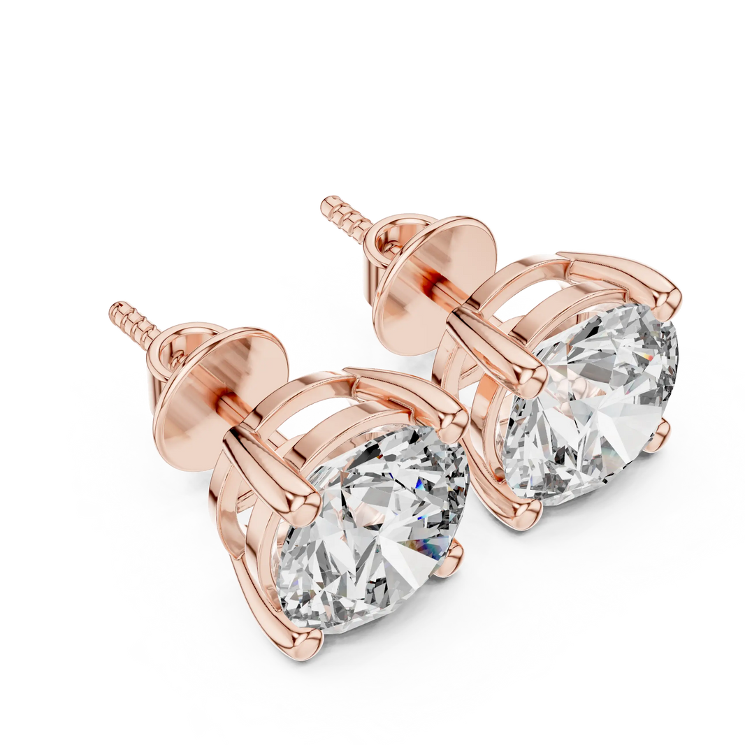 Round moissanite stud earrings in rose 925 sterling silver, four-prong basket, angled view