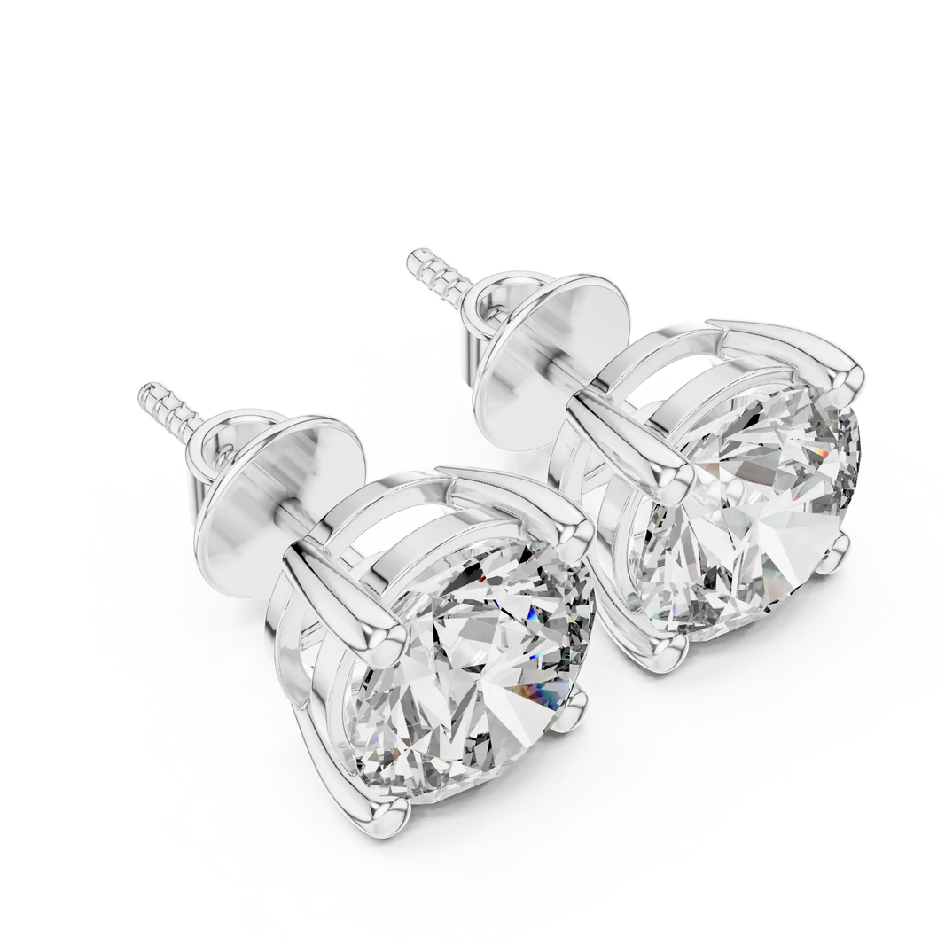 Round moissanite stud earrings in white 925 sterling silver, four-prong basket, angled view