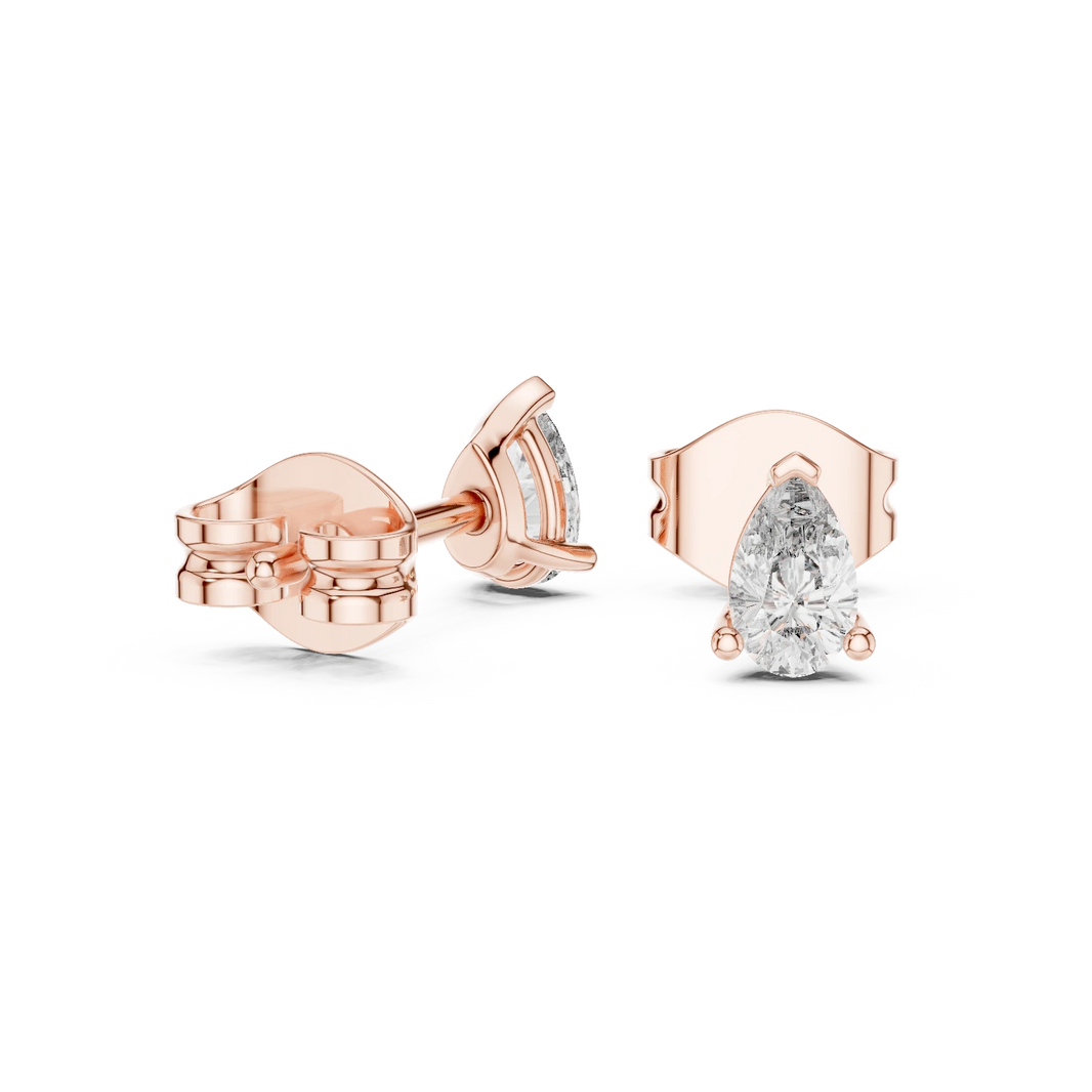 Pear Moissanite Three Prong Stud Earrings in rose 925 sterling silver, view 1