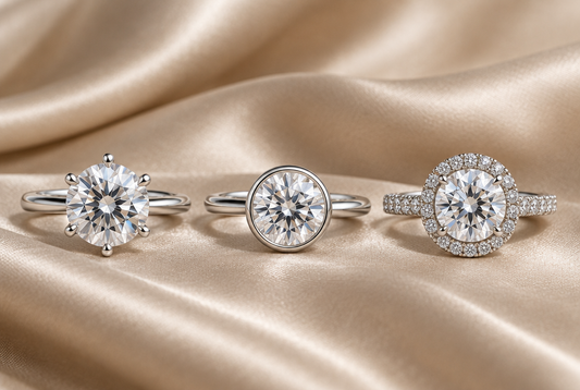Prong, bezel and halo moissanite rings side by side