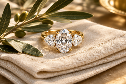 Three-stone moissanite ring with oval center and pear sides