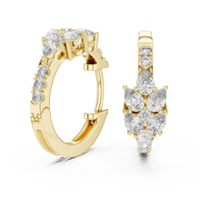 Pear moissanite cluster huggie hoop earrings in yellow 925 sterling silver, view 1